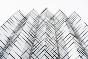 Glass surface of skyscrapers view in district of business centers with reflection on it, black and...