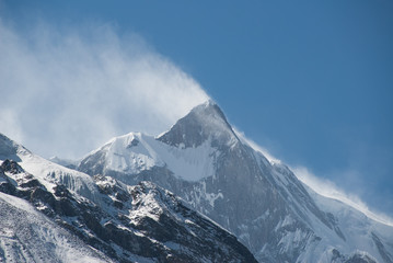 Snow blowing of Tilicho Peak