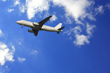 Naklejka na ściany i meble Airplane with beautiful sky on background