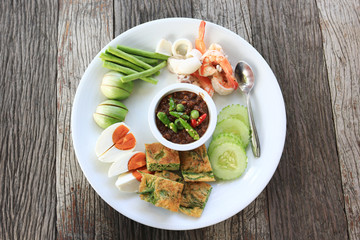 Thai food, Chili shrimp paste and vegetables set on wooden background