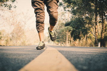 Man running on the road for health, color of vintage tone selective and soft focus