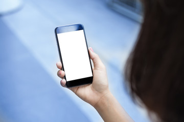 Close-up of Female hands holding white screen mobile smart phone