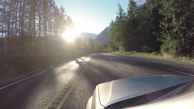 Driving Mountain Road to Snowy Peak in Background POV
