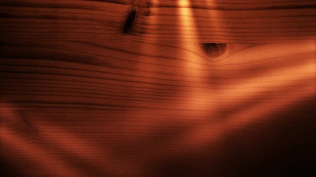 Spotlights shining on a wooden board. 4K UHD seamless loop video.