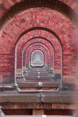 View over the bridge piers of the Goeltzschtalbrücke in Thuringia, the longest brick bridge in the...