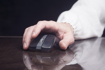 computer mouse in man's hand