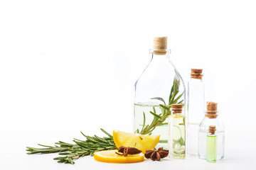 Aromatic oils in glass bottles on a white table. Body care. Healthy lifestyle. Isolated.