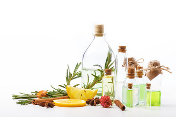 Aromatic oils in glass bottles on a white table. Body care. Healthy lifestyle. Isolated.