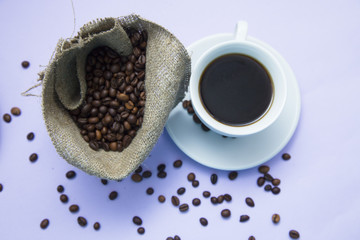 Fototapeta premium Coffee with sweets on light purple background