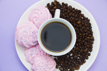 Coffee with sweets on light purple background