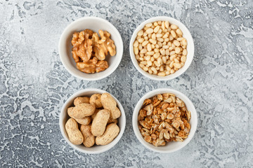 Different nuts on gray background