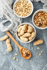 Different nuts on gray background