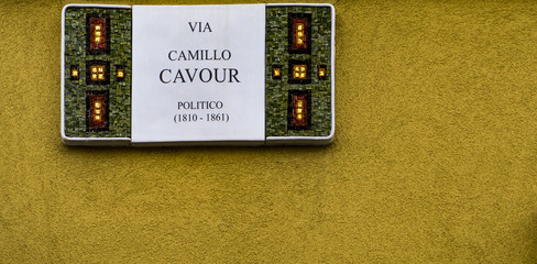 Decorative street sign on the building from Ravenna, Italy