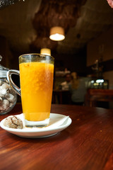 Pouring tea in a glass cup