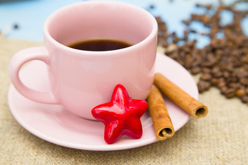 Coffee with sweets on a blue wooden background