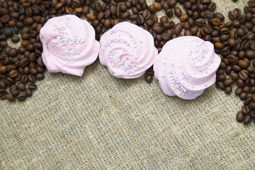 Coffee with sweets on a blue wooden background