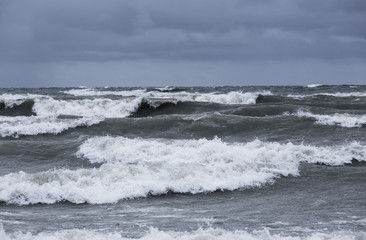 storm clouds and rough waves on the water