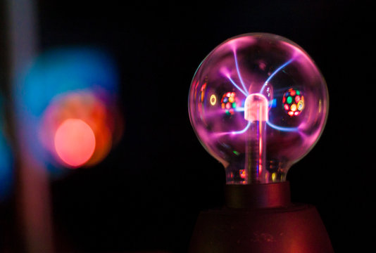 Closeup of an electric energy plasma sphere. Glowing electrostatic ball.