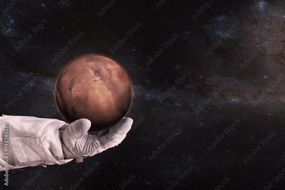 Wall mural mars in the hands of astronaut. elements of this image furnished by nasa.