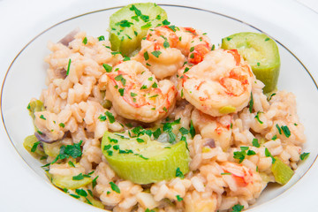 dish with risotto with prawns and zucchini