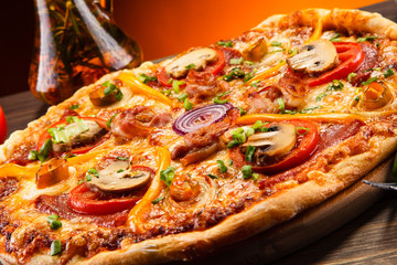 Pizza with salami, mushrooms and vegetables
