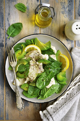 Green salad with avocado, baby spinach and chicken fillet.Top view with copy space.