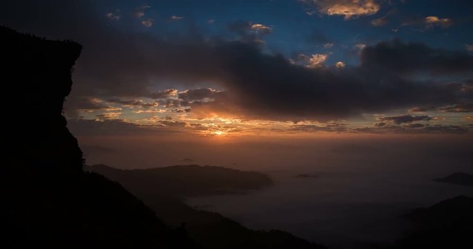 Time lapse of beautiful sunrise during a cloudy day at Phu Chi Fah National Park, Chiang Rai. 