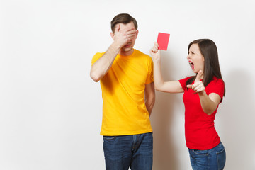 European angry aggressive young woman, football referee in red uniform show red soccer card,...