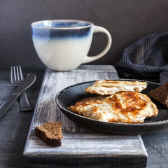 Appetizing meat fried in batter with Morse and black bread. © foodfotus