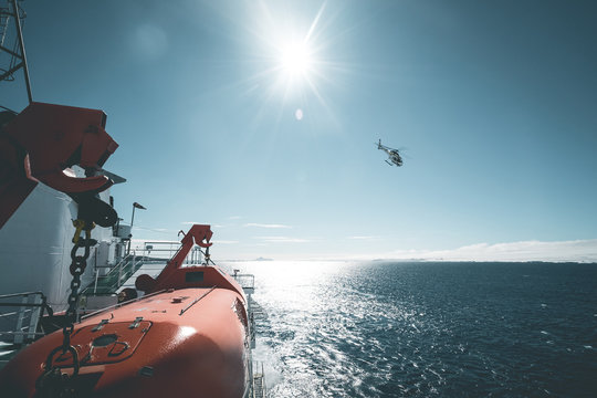 Helicopter departing from Expedition Vessel - Antarctica