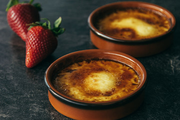 Creme brulee french vanilla dessert on dark background