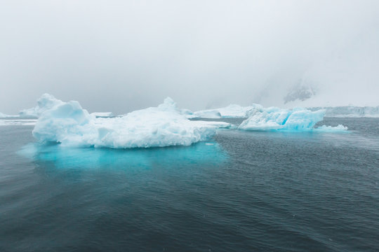 Pointed Ice Bergs tower out of the Ocean - Antarctica