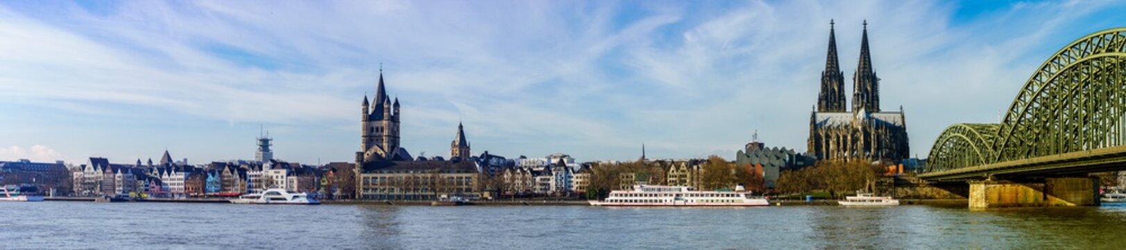 Panorama of Cologne with Great St. Martin Church, Cologne Cathedral, Hohenzollern Bridge and the Rhine river, Germany