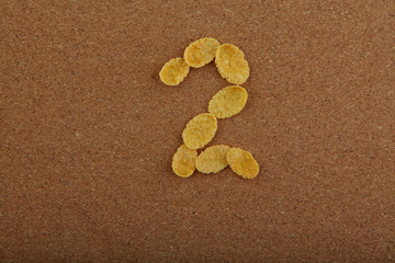 Corn Flakes numbers wooden background 