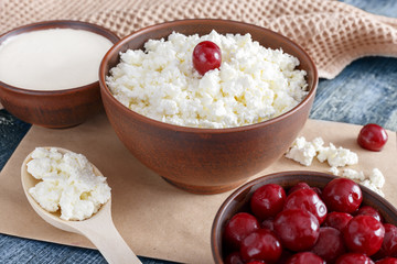 Cottage cheese on a wooden table close up