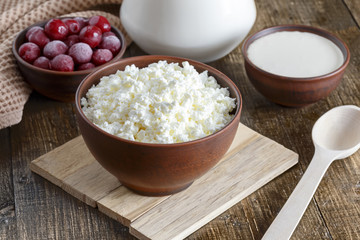 Cottage cheese on a wooden table close up