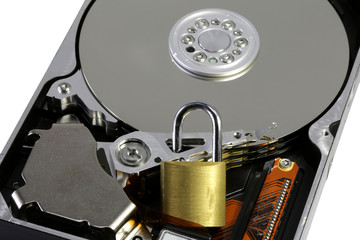 white background and hard disk of a computer with the padlock to make the data safe in a figurative sense