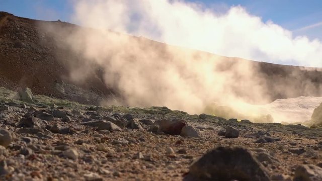 Fumarole field in Ebeko volcano caldera. Emission of hot sulfur gas.