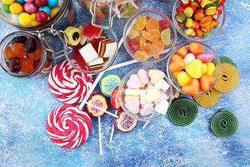 candies with jelly and sugar. colorful array of different childs sweets and treats.