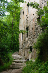 Fototapeta premium Ruins of old stone farm building in mountains jungles and rainforest with waterfalls in warm fog weather with rain. Picture taken in Amalfi coast, Italy