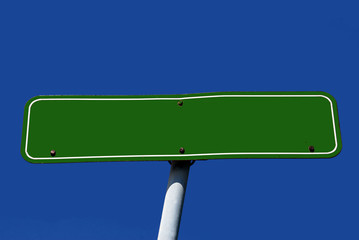 Road sign with empty space and blue sky in the background.