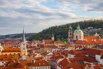Obraz premium Bright sunset view of old town Mala Strana skyline from Hradcany castle. Skyline of Prague, Czech Republic