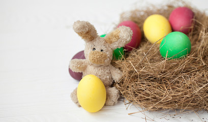 Easter decoration with sugar rabbits, color eggs