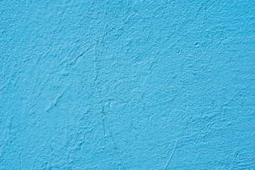 Background of a blue painted cement wall, rough cast of cement and concrete wall texture, decorative rustic coating