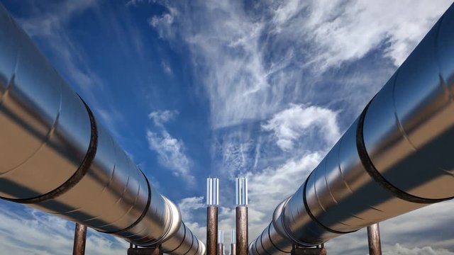 2 oil pipelines under blue sky with clouds