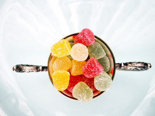 the metal bowl of gummy candies,desserts,