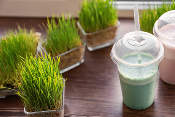 Different protein shakes on window sill in sport bar