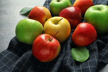 Ripe juicy apples on table