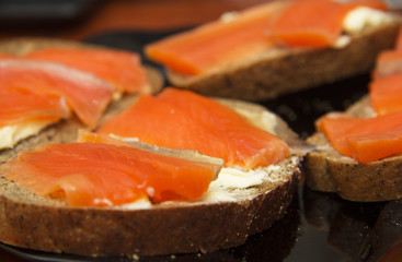Fresh salmon sandwich with salted salmon and butter and dark bread