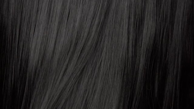 Hair texture background, no person. Black shiny hair moving slowly 24 fps from 60 fps
